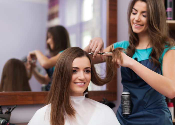 beautiful-woman-has-cutting-hair-hairdresser