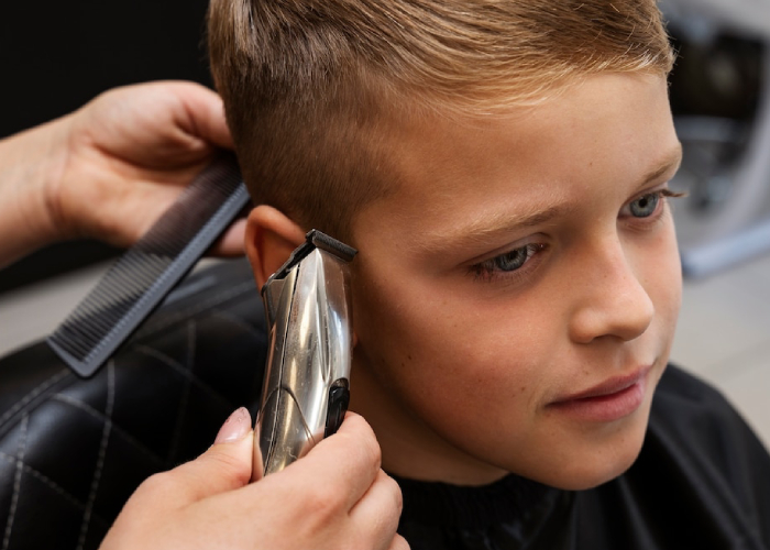 high-angle-kid-getting-haircut-salon