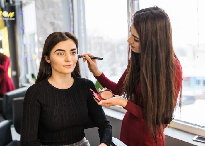 young-model-with-big-eyes-is-having-make-up-proced