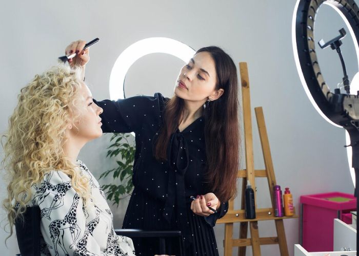 young-woman-looking-away-while-standing-mirror