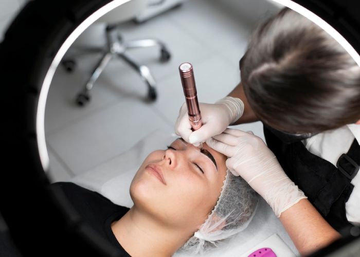 young-woman-going-through-microblading-treatment